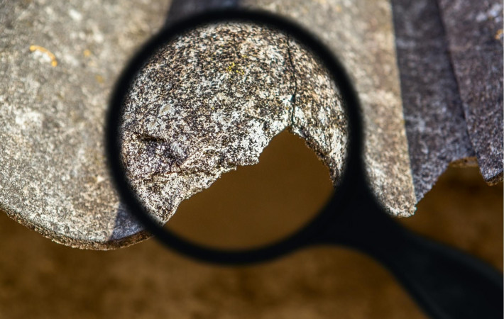 Magnifying glass on asbestos