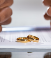 Wedding rings on top of contract