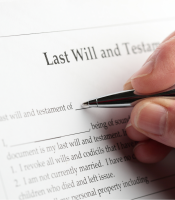 Man signing last Will and testament