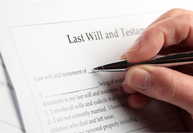 Man signing last Will and testament